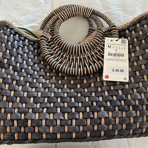 Stylish Black and Tan Woven Handbag